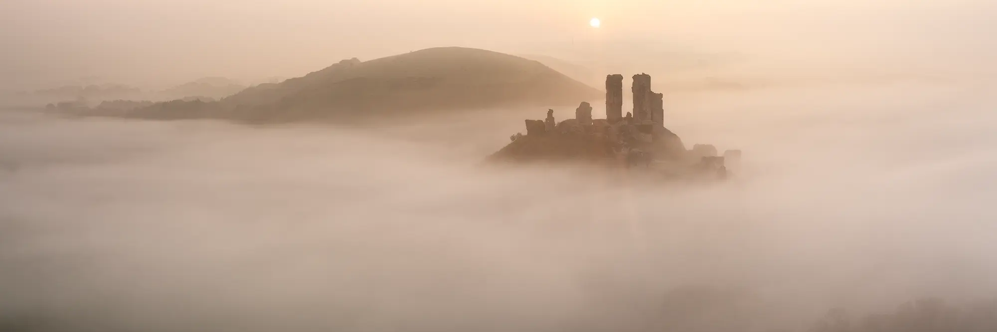 Panorama of Corfe Castle in the mist